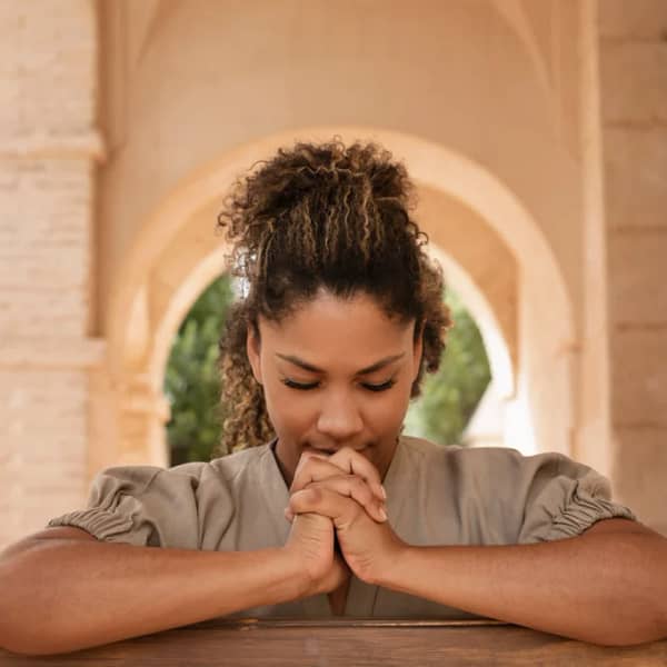 A woman praying in church