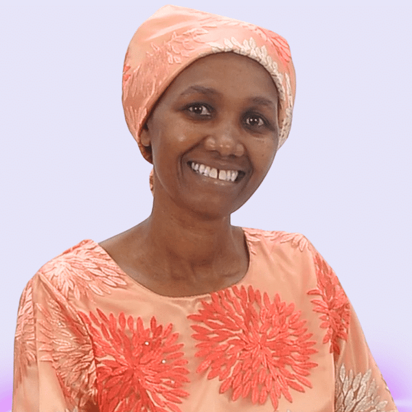 Pastor Teresia Karanja smiling at the camera-